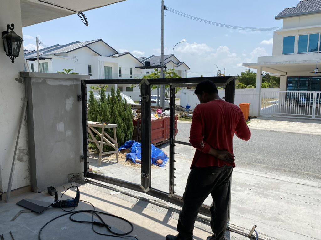 SPG technician working on an auto gate installation